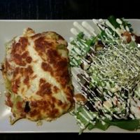 Lasagna with salad at De Plaats in Bruges