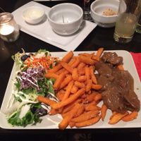 Vegan Flemish stew (vegan stoofvlees) with sweet potato fries at De Plaats in Bruges