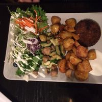 Vegan burger (inside was more like rice or something...) with delicious cajun potatoes and veggies at De Plaats in Bruges