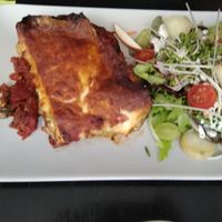Vegetarian lasagna with salad at De Plaats in Bruges