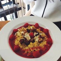 Delicious sweet meal for lunch: cous cous with maple sirup, raspberries, dried dates and almonds.
Tasty!
 at Mondieu - Laurinska in Bratislava