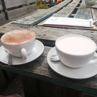 Pink latte with oat milk on the right at Wood and Green Cafe in Wadebridge