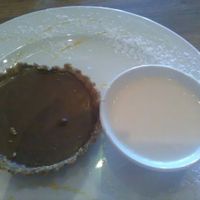 Mini nutty chocolate pie with coconut ice-cream (melted here). Only vegan dessert option but oh so yummy. at Duke's Burgers in Johannesburg