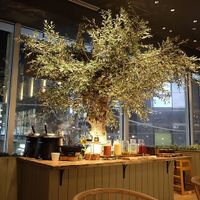 Tree decor next to the buffet table at Cosme Kitchen Adaptation - Atre West in Tokyo