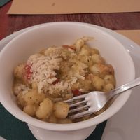 Vegan pesto gnocchi with cherry tomatoes at Origano Campo de' Fiori in Rome