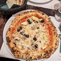 Vegan pizza with artichoke, olives and mushroom at Origano Campo de' Fiori in Rome