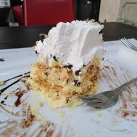 3 layers of custard and chocolate chips, 2 layers of flaky pastry, vegan whipped cream and chocolate sauce. at Origano Campo de' Fiori in Rome