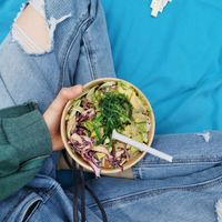 Bowl with zoodles, rice, edamame, avocadeo, some veggies, Peanut satay sauce and Terijaky sauce at Kenny's World of Juices in Vienna