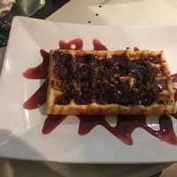 Brownie cream, cinnamon & cherries sauce dinkel waffle  at Kenny's World of Juices in Vienna