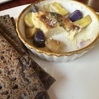 Melted and Roasted Brie (macadamia nuts based) served with baked potato, cooked with thyme and levain bread- the cheese is so good #Veganuary at Delice & Sarrasin in New York City