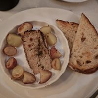 Roasted melted "brie" cheese cooked with thyme, served with potatoes at Delice & Sarrasin in New York City