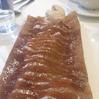 Apple and caramel crepe with vanilla ice cream. Enough for 2 to share! Delicious!  at Delice & Sarrasin in New York City
