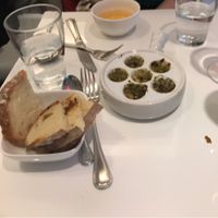 French cider and vegan ";snail "; dish  at Delice & Sarrasin in New York City