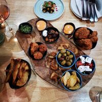 Sharing board, chips, cauliflower wings, aubergine harrisa rolls at The Allotment in Manchester