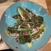 Broccoli and Chicory. Topped with olive tapenade, pomegranates and toasted hazelnuts  at The Allotment in Manchester