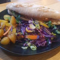 Bahn Mi Sandwich
-
Marinated tofu, pickled carrots & cucumber with fresh chilli, coriander & sriracha mayonnaise on a sourdough baguette, served with salt & pepper potatoes & Asian at The Allotment in Manchester