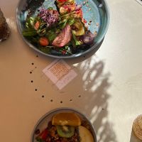 plate with different breads on top. granola, yoghurt dish below  at Joy Healthyfood in Montpellier