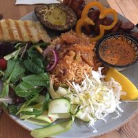 Fried plantain with jollof rice and salad at Ataya Caffe at ATAYA in Berlin