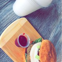 Lentil cheese burger with shiitake bacon and coconut shake  at The Pureganic Cafe in Harrison