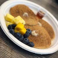 Pancakes with fruit  at The Pureganic Cafe in Harrison