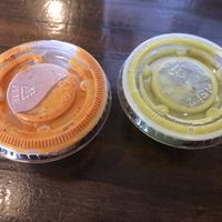 Both provided salsas are vegan. The reddish one is spicier! at La Mexicana in Newport