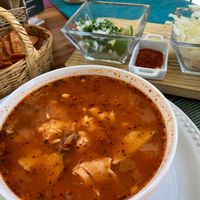 Pozole comes with tortillas, fresh cabbage and radishes, onions and cilantro, and dried chili powder. Make it to your own taste. 🤗 at Sirena Morena in Cancun