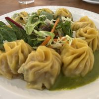Selection of three kinds of momo with salad and slightly tangy green sauce  at Cafe Tibet in Berkeley