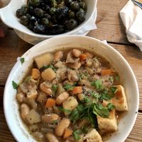 Apetizer: oliwki z pieca; Zupa „Ribollita” (kapusta włoska, ziemniaki, fasola, focaccia) • Appetiser: olives; Soup „Ribollita: cabbage, potatoes, beans, focaccia bread  at Serio in Gdynia