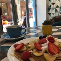 Vegan Pancakes with fruit, whipped cream, and maple syrup; americano on the side at Cloud Cakes - Mandar in Paris