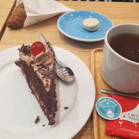 Croissant, chocolate cake and white chocolate macaron. at Cloud Cakes - Mandar in Paris