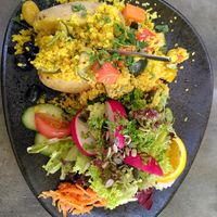 Oven potato with mixed salad, couscous,  grilled veggies & olives (vegan) at Peter&Silie in Ingelheim