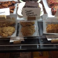 baked goods (rice paper bacun, sweet potato brownies, cherry bread pudding, biscuits, & tomato onion garlic bread)  at The Breakfast Club in Lawrence
