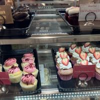 Chocolate filled, old-fashioned red velvet, vanilla, raspberry, and French strawberry cupcakes.  at Out of the Bubble Bakery in Springfield