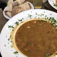 very full plate of yummy bean-minestrone, organic lemonade and bread 😄 at Bio im Bahnhof in Goerlitz