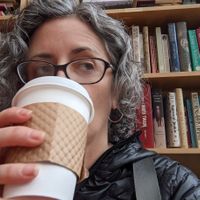 Drinking vegan chai with oat milk at Book Trader Cafe in New Haven