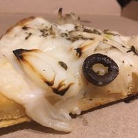 Traditional fainá - with onion and black olives at Pizza Vegana - Recoleta in Buenos Aires