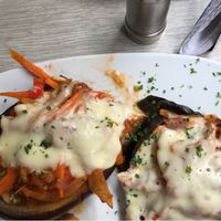 Roasted eggplant with veggies and vegan cheese at Avocados in Bogota
