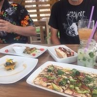 Sashimi (front), guava cake (left), BBQ dog and the coconut mojito with mint hand-picked from the deck garden. at Marcial by Mako in Cabo San Lucas