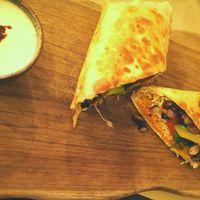 Vegan wrap with black beans, avocado served with coconut sour creme. 85.000 Rp at Happy Banana in 