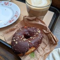 Doughnut and oat latte at Shakespeare and Company Cafe in Paris