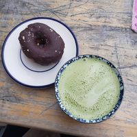 matcha latte with soya milk and donut at Shakespeare and Company Cafe in Paris