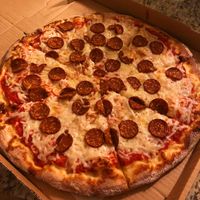 Vegan cheezy and pepperoni pizza at Gourmet Pizza Company in Tampa