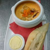 Xmas Menu roasted red pepper and ginger soup..  at The Farmer's Union Pub  in Exeter