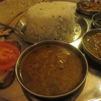 no. 36 vegetarian thali (four kinds of vegetarian curries: cauliflower, potatoes, dal (lentils,) saag (spinach,) channa (chickpeas,) tomatoes, onions, basmati rice, without raeta (spiced yoghurt) and with chapati instead of naan (flatbread)) (vegan) at Star of India in Saarbrucken