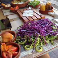 Raw noodles with pesto, hummus, bread and tomatoes (+ in the background: lasagna) at Delicias y Namaste in Fuerteventura