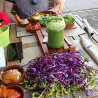 Raw noodles with pesto, hummus, bread and tomatoes (+ in the background: lasagna) at Delicias y Namaste in Fuerteventura