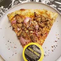 Vegan pizza and buttery garlic sauce at Mikey's Late Night Slice in Columbus