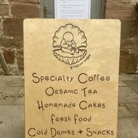 Main board on entrance  at Pilgrims Coffee House in Lindisfarne