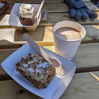 Vegan Cuthberts Slice and Americano coffee with oat milk at Pilgrims Coffee House in Lindisfarne