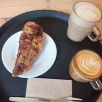 Sweet coffee focaccia bread, oat chai and oat flat white at Pilgrims Coffee House in Lindisfarne